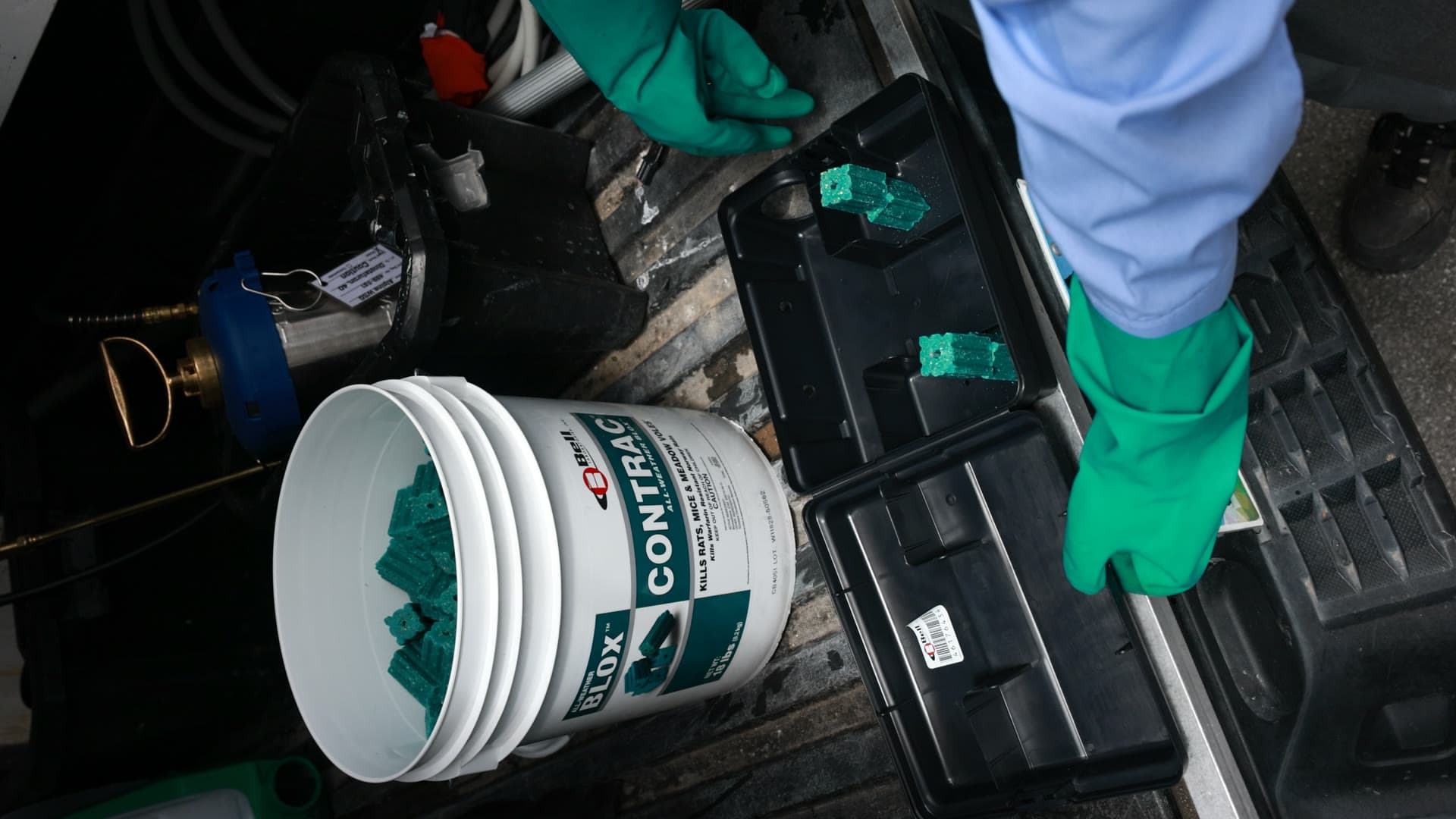 Peak Pest Control technician preparing rodent bait stations