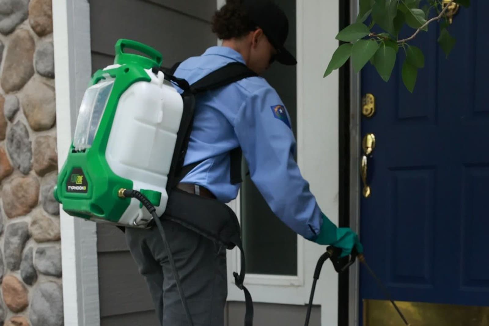 A Peak Pest Control technician servicing a Reno-area home